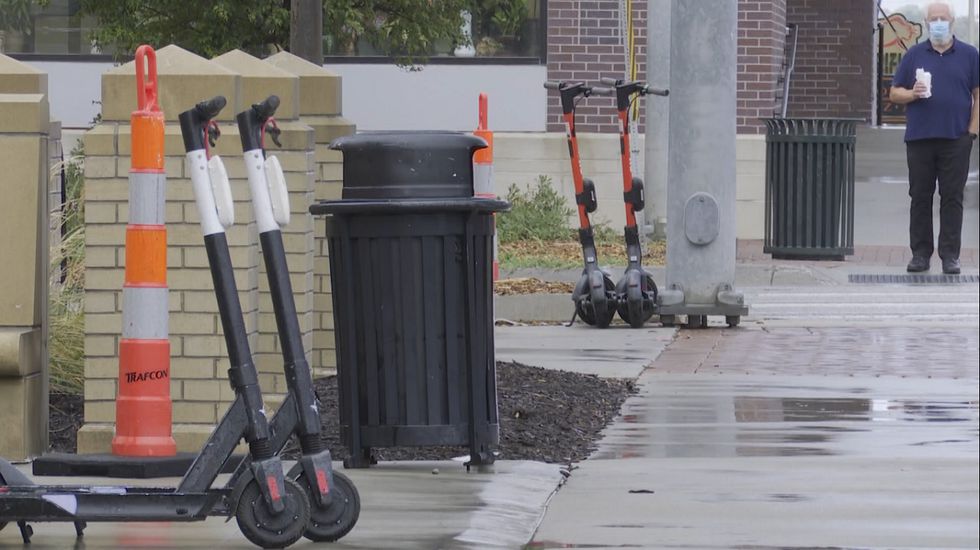 Lincoln scooter kicks-off with dozens of scooters parked on downtown street